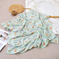 Lange bébé en mousseline de coton motif dinosaures menthe